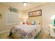 Quaint bedroom featuring a full-size bed and coastal-themed decor at 701 N Atlantic Ave # 102, New Smyrna Beach, FL 32169