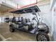 Grey golf cart in garage, side view at 701 N Atlantic Ave # 102, New Smyrna Beach, FL 32169