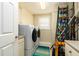 Bright laundry room with washer, dryer, and ample storage at 701 N Atlantic Ave # 102, New Smyrna Beach, FL 32169