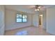 Bedroom with tile floor, ceiling fan and sliding door to patio at 752 Tarry Town Trl, Port Orange, FL 32127