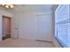 Well-lit bedroom with tile floors and a large closet at 752 Tarry Town Trl, Port Orange, FL 32127