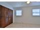 Bedroom with wood closet doors and tile floors at 752 Tarry Town Trl, Port Orange, FL 32127