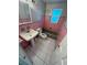 Retro-style bathroom with pink tile and bathtub at 795 Biro Dr, Port Orange, FL 32129