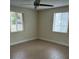 Well-lit bedroom with laminate floors and double closets at 795 Biro Dr, Port Orange, FL 32129