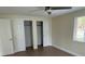 Bedroom with light walls, laminate floors and double closets at 795 Biro Dr, Port Orange, FL 32129