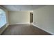 Bright and airy living room with light colored walls and laminate flooring at 795 Biro Dr, Port Orange, FL 32129