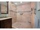 Large bathroom with a walk-in shower, neutral tile, and built-in shelving at 803 Silk Oak Ct, New Smyrna Beach, FL 32168