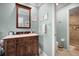 Bathroom with vanity, shower and wood cabinet at 803 Silk Oak Ct, New Smyrna Beach, FL 32168