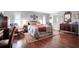 Main bedroom with hardwood floors, and ensuite bath at 803 Silk Oak Ct, New Smyrna Beach, FL 32168