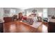 Main bedroom with hardwood floors and ensuite bathroom at 803 Silk Oak Ct, New Smyrna Beach, FL 32168