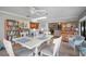 Bright dining area with white table and access to kitchen at 803 Silk Oak Ct, New Smyrna Beach, FL 32168