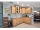 Kitchen corner with granite countertops, light wood cabinets, and mosaic backsplash at 803 Silk Oak Ct, New Smyrna Beach, FL 32168