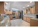 Spacious kitchen with granite countertops, stainless steel appliances, and light wood cabinets at 803 Silk Oak Ct, New Smyrna Beach, FL 32168