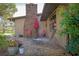 Brick patio with lounge chairs and umbrella at 803 Silk Oak Ct, New Smyrna Beach, FL 32168