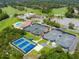 Aerial view of tennis courts and clubhouse at 803 Silk Oak Ct, New Smyrna Beach, FL 32168