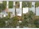 Aerial view of house and neighborhood, showcasing street and landscaping at 810 E 9Th Ave, New Smyrna Beach, FL 32169