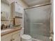 Clean bathroom, featuring a walk-in shower and tiled walls at 810 E 9Th Ave, New Smyrna Beach, FL 32169