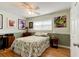 Bedroom with a desk and leafy patterned bedding at 810 E 9Th Ave, New Smyrna Beach, FL 32169