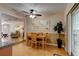 Cozy dining area with a wooden table and chairs near the kitchen at 810 E 9Th Ave, New Smyrna Beach, FL 32169