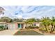 Front view of a charming house with a pink facade at 810 E 9Th Ave, New Smyrna Beach, FL 32169