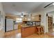 Well-equipped kitchen with light wood cabinets and granite countertops at 810 E 9Th Ave, New Smyrna Beach, FL 32169