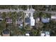 Aerial view of a house with a pool and lush landscaping at 814 E 20Th Ave, New Smyrna Beach, FL 32169