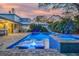 Relaxing backyard oasis with pool and spa at dusk at 814 E 20Th Ave, New Smyrna Beach, FL 32169