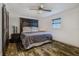 Spacious bedroom with rustic wood headboard and barn door at 814 E 20Th Ave, New Smyrna Beach, FL 32169