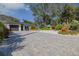 Landscaped front yard with paver driveway at 814 E 20Th Ave, New Smyrna Beach, FL 32169