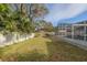 Large backyard with grassy area, providing plenty of space for recreation at 826 E 12Th Ave, New Smyrna Beach, FL 32169