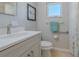 Clean bathroom with updated vanity and shower at 826 E 12Th Ave, New Smyrna Beach, FL 32169