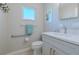 Accessible bathroom with a toilet, sink, and shower, plus grab bars at 826 E 12Th Ave, New Smyrna Beach, FL 32169