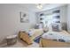 Guest bedroom with twin beds featuring coastal decor and blue and white bedding at 826 E 12Th Ave, New Smyrna Beach, FL 32169