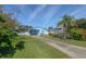 Cute light blue house with a nicely landscaped yard at 826 E 12Th Ave, New Smyrna Beach, FL 32169