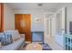 Small living area with a gray sofa, a wooden coffee table, and a view of a hallway at 826 E 12Th Ave, New Smyrna Beach, FL 32169