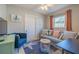 Cozy living room featuring a gray couch, blue armchair and coastal decor at 826 E 12Th Ave, New Smyrna Beach, FL 32169