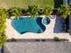 Aerial view of freeform pool and surrounding landscape at 831 Evergreen St, New Smyrna Beach, FL 32169