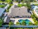 Aerial view of a single-Gathering home with pool and detached shed at 831 Evergreen St, New Smyrna Beach, FL 32169