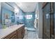 Stylish bathroom with modern vanity and hexagon tile floors at 831 Evergreen St, New Smyrna Beach, FL 32169