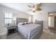 Main bedroom with king-size bed, ceiling fan, and ample light at 831 Evergreen St, New Smyrna Beach, FL 32169