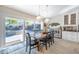 Dining room with farmhouse table and pool view at 831 Evergreen St, New Smyrna Beach, FL 32169