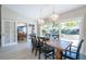 Bright dining room with sliding doors leading to the pool area at 831 Evergreen St, New Smyrna Beach, FL 32169