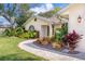 Landscaped walkway leading to house entrance at 831 Evergreen St, New Smyrna Beach, FL 32169