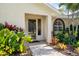 Walkway to house entrance with lush landscaping at 831 Evergreen St, New Smyrna Beach, FL 32169