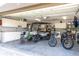 Spacious garage with storage cabinets, golf cart, and bicycles at 831 Evergreen St, New Smyrna Beach, FL 32169