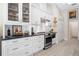 Modern kitchen with stainless steel appliances and white shaker cabinets at 831 Evergreen St, New Smyrna Beach, FL 32169