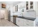 Modern kitchen with stainless steel appliances and white shaker cabinets at 831 Evergreen St, New Smyrna Beach, FL 32169