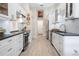 Modern kitchen with stainless steel appliances and white shaker cabinets at 831 Evergreen St, New Smyrna Beach, FL 32169