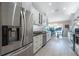 Modern kitchen with stainless steel appliances and white shaker cabinets at 831 Evergreen St, New Smyrna Beach, FL 32169