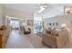 Spacious living room showcases a comfortable beige sofa and a glass-top coffee table at 831 Evergreen St, New Smyrna Beach, FL 32169